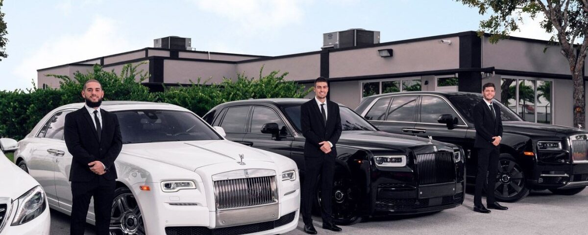 mebs-standing-by-the-cars