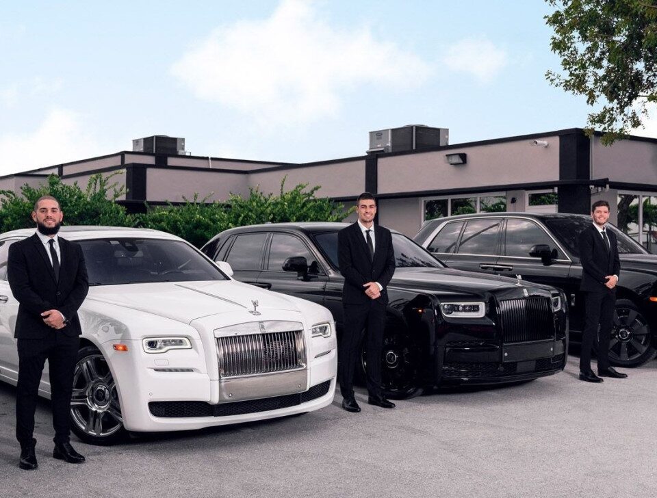mebs-standing-by-the-cars